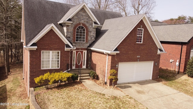 view of front of property with a garage, a shingled roof, concrete driveway, stone siding, and brick siding