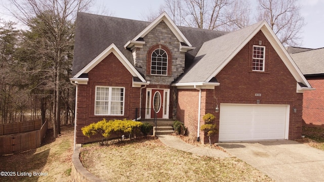 view of front facade featuring stone siding, brick siding, and concrete driveway