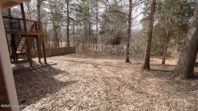 view of yard with stairs and a deck