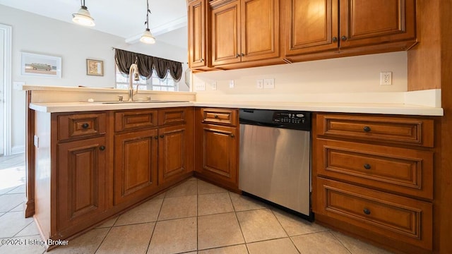 kitchen featuring light tile patterned floors, stainless steel dishwasher, brown cabinetry, and a sink