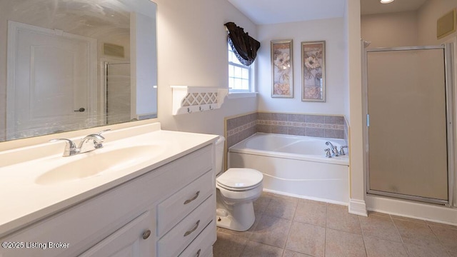 full bathroom with a stall shower, toilet, tile patterned flooring, vanity, and a bath