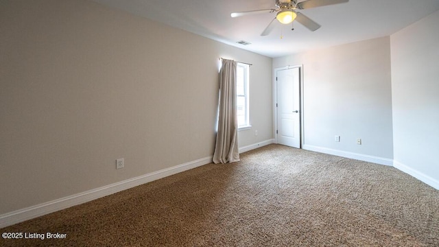 unfurnished room featuring ceiling fan, carpet floors, visible vents, and baseboards