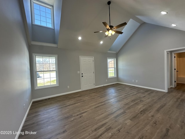 unfurnished living room featuring high vaulted ceiling, dark wood finished floors, recessed lighting, baseboards, and ceiling fan