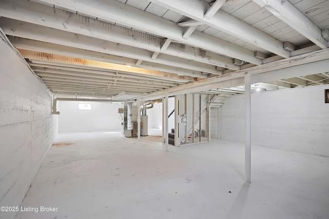 basement with heating unit and water heater