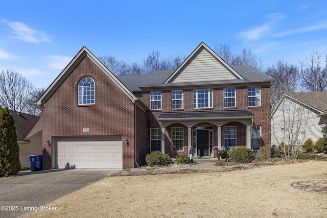 view of front facade featuring brick siding, covered porch, driveway, and an attached garage