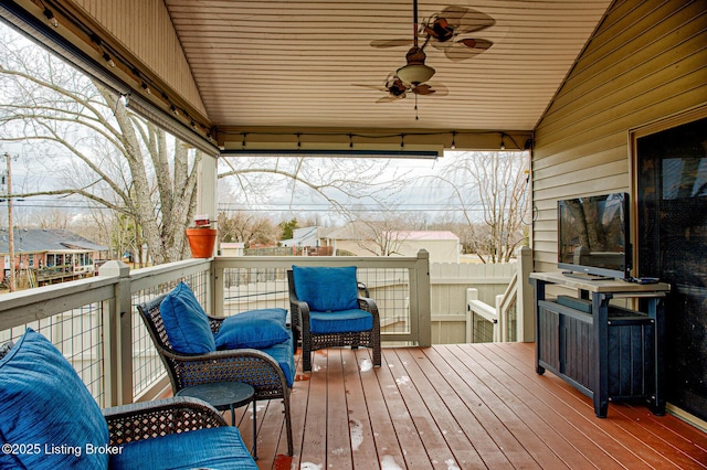 wooden terrace featuring a ceiling fan