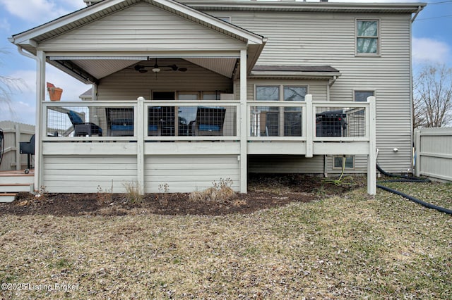 back of house featuring a deck, fence, and a ceiling fan