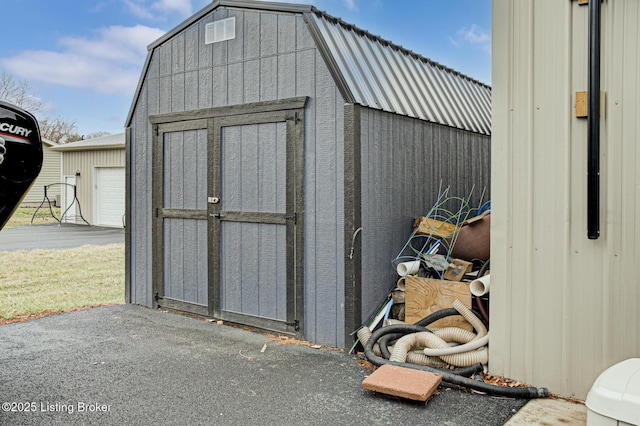 view of shed featuring a garage