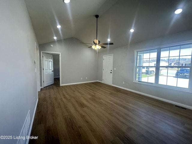 unfurnished living room with visible vents, dark wood finished floors, baseboards, lofted ceiling, and ceiling fan