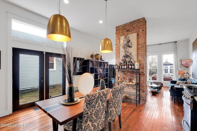 dining area with french doors, hardwood / wood-style flooring, and recessed lighting