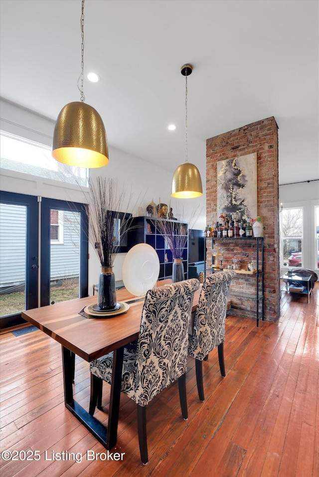 dining room with recessed lighting and wood-type flooring