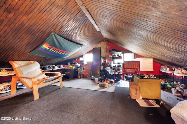 bedroom with lofted ceiling and multiple windows