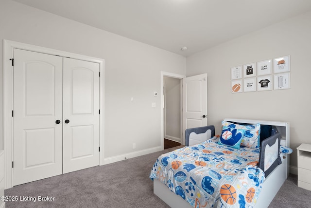 bedroom featuring carpet, a closet, and baseboards