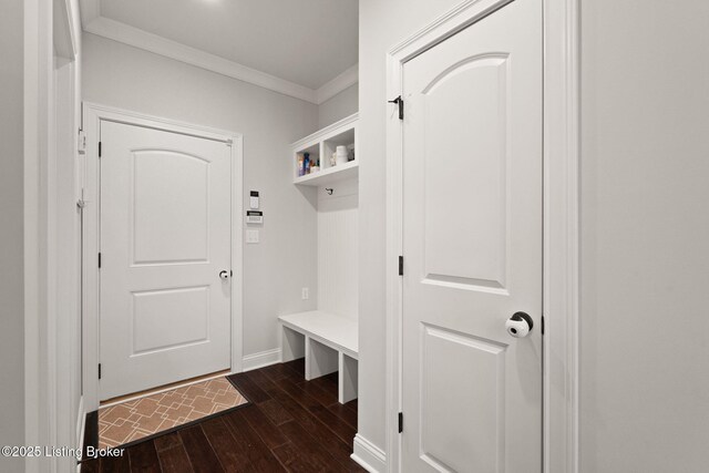 mudroom with baseboards, ornamental molding, and dark wood finished floors