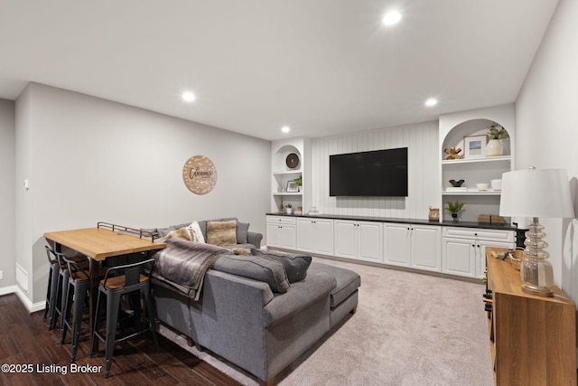 living area with built in features, recessed lighting, visible vents, and baseboards