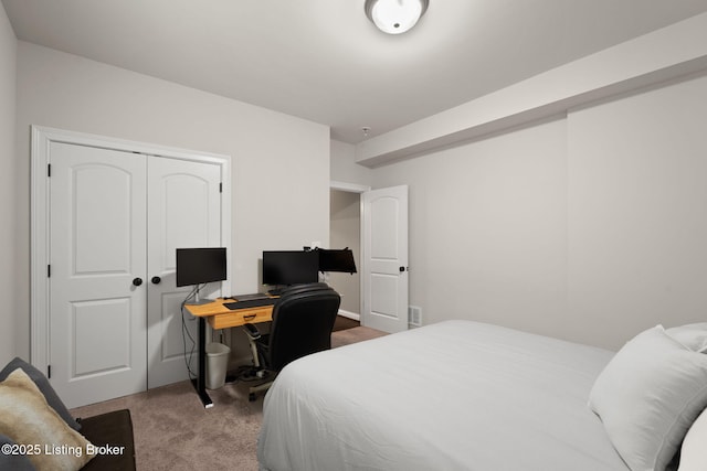 carpeted bedroom with a closet