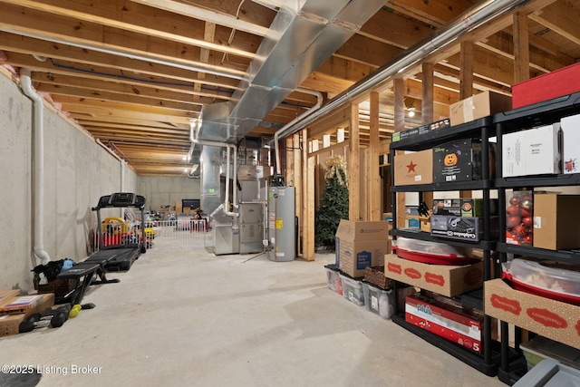 unfinished basement with heating unit and gas water heater