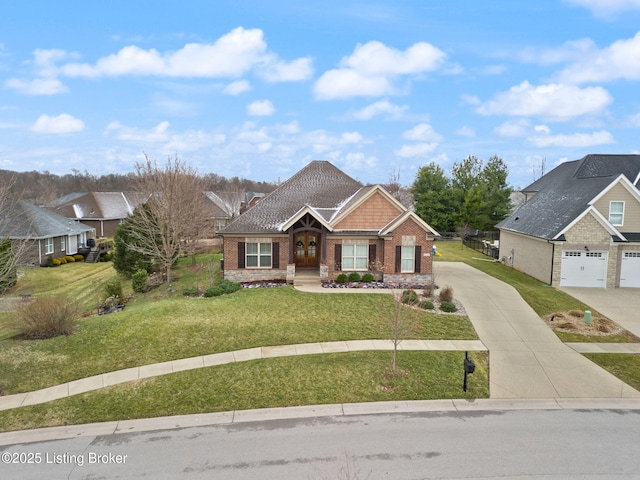 craftsman-style home with driveway, a front lawn, and brick siding