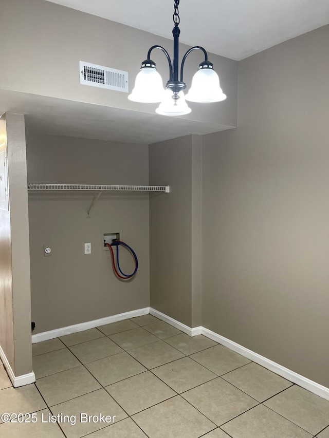 laundry room featuring light tile patterned floors, baseboards, visible vents, washer hookup, and a chandelier