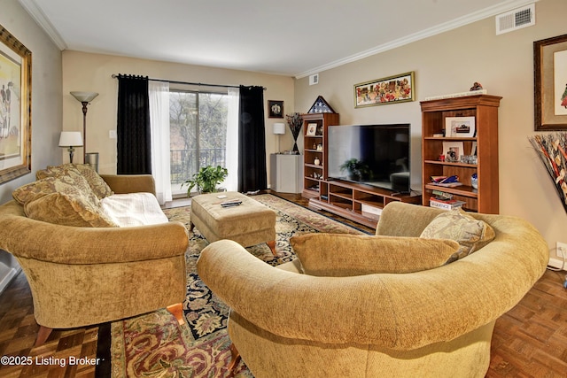 living room with ornamental molding, visible vents, and baseboards