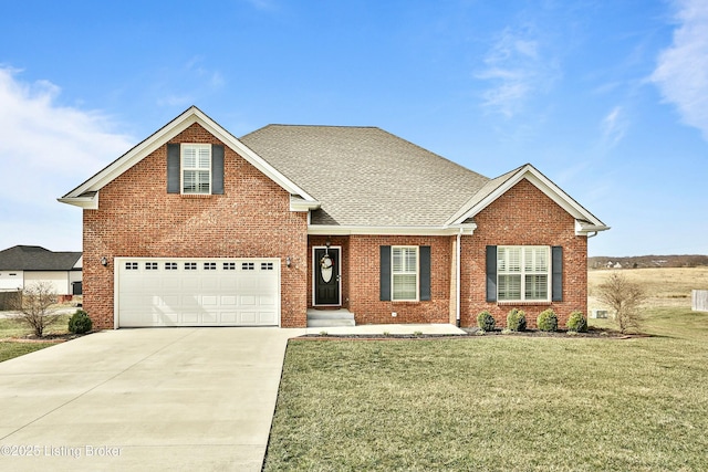 traditional-style home with a front yard, brick siding, driveway, and roof with shingles