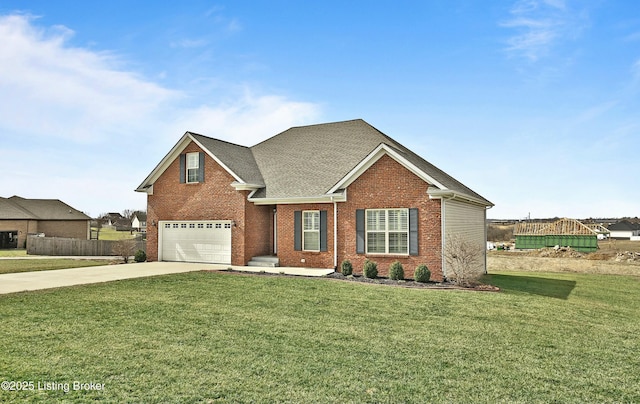 traditional-style home with a front yard, fence, concrete driveway, a garage, and brick siding