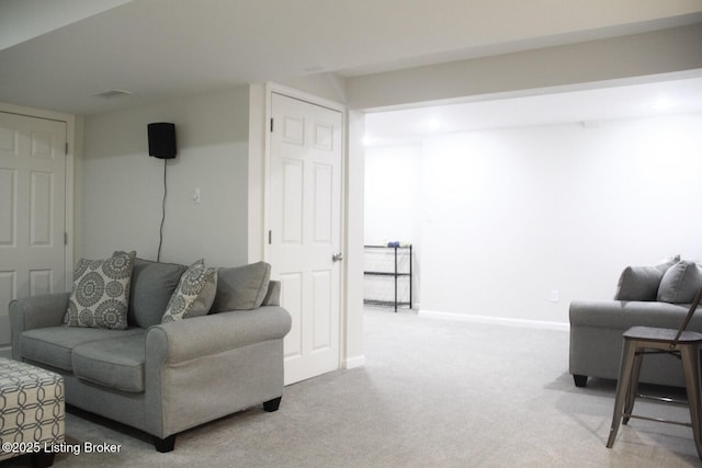 living room with carpet and baseboards