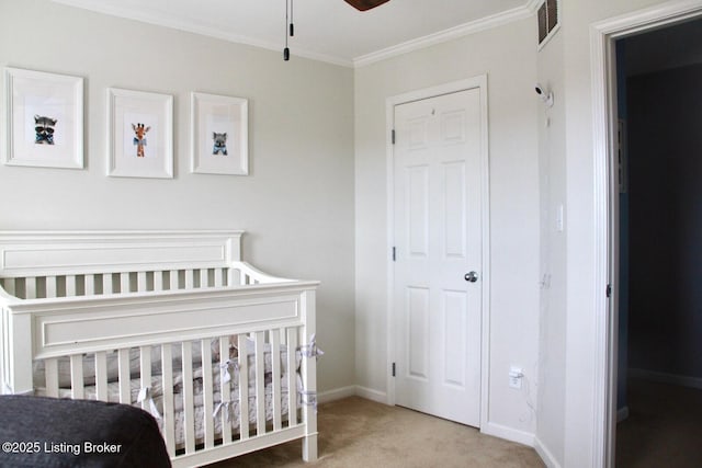 bedroom with ornamental molding, carpet, visible vents, and baseboards
