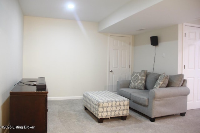 sitting room with carpet floors and baseboards