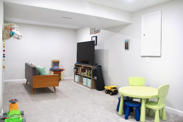 recreation room featuring carpet flooring, visible vents, and baseboards