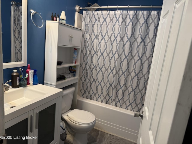 bathroom with vanity, toilet, and shower / bath combo with shower curtain