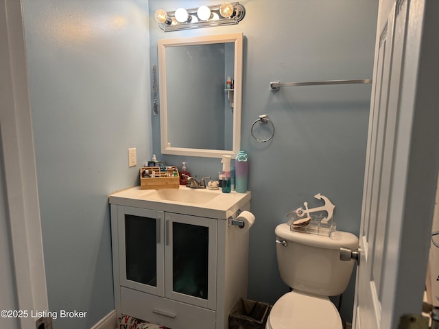 half bath with vanity and toilet