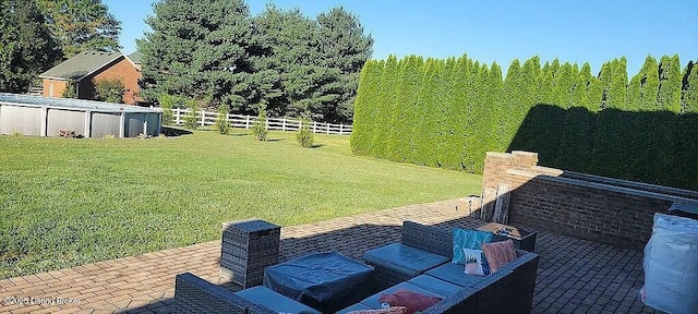 view of yard featuring an outdoor pool, outdoor lounge area, fence, and a patio