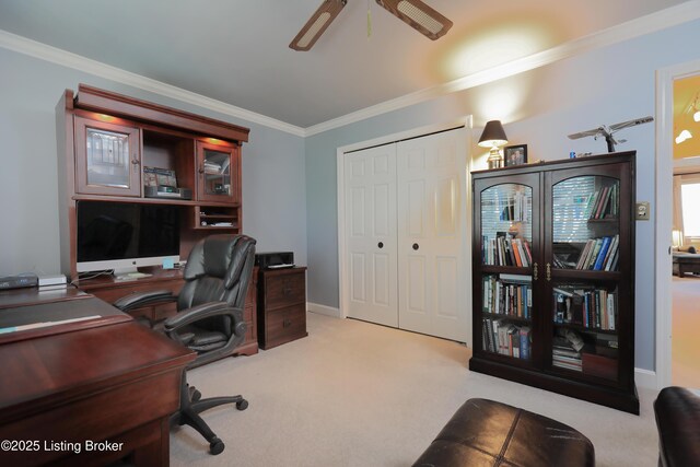 office space featuring crown molding, carpet, baseboards, and ceiling fan