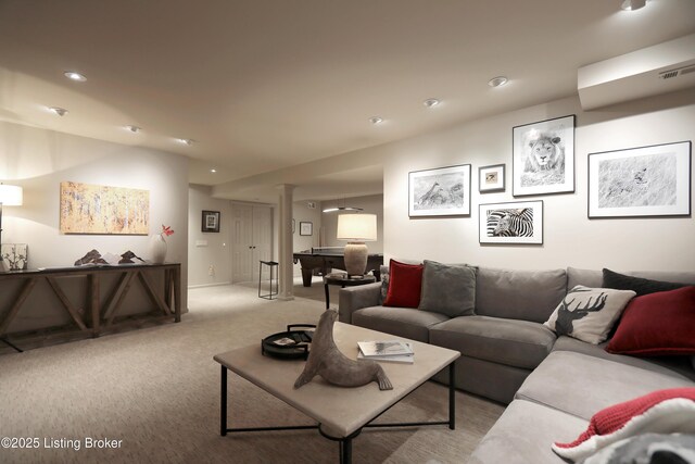 living room featuring recessed lighting, carpet, visible vents, and ornate columns