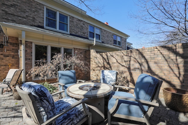 view of patio with fence and an outdoor fire pit