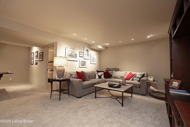 living room featuring recessed lighting, light colored carpet, and baseboards