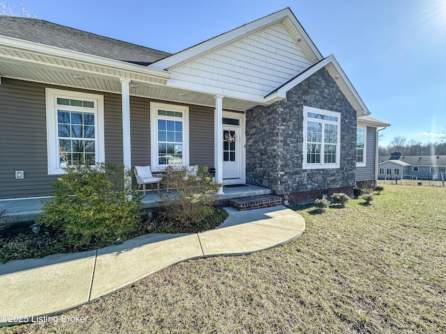 view of front of property with a front lawn and a porch