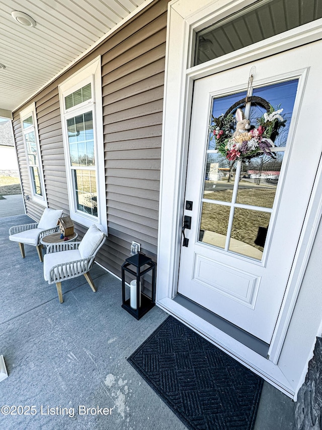 doorway to property with covered porch