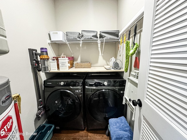 laundry room with water heater, laundry area, and washer and dryer