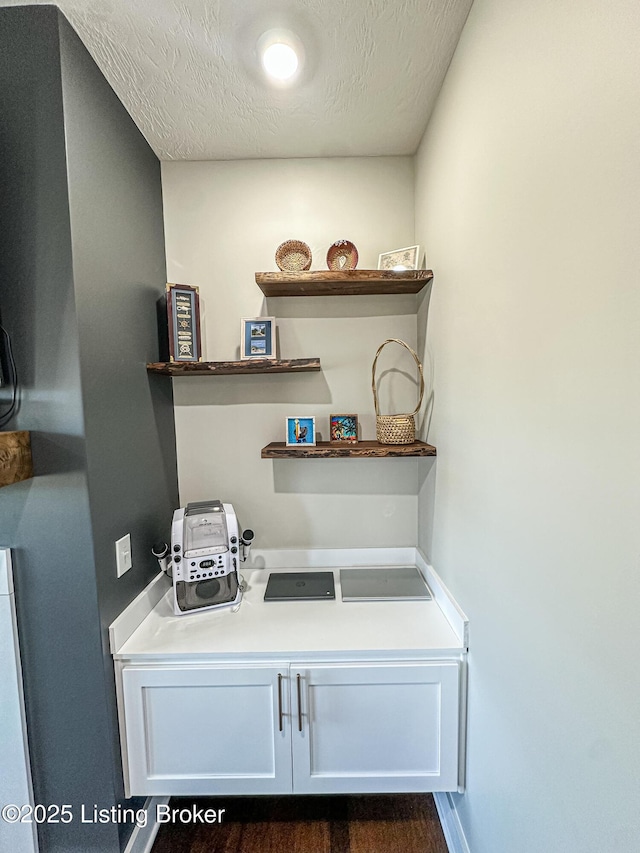 office with a textured ceiling and baseboards