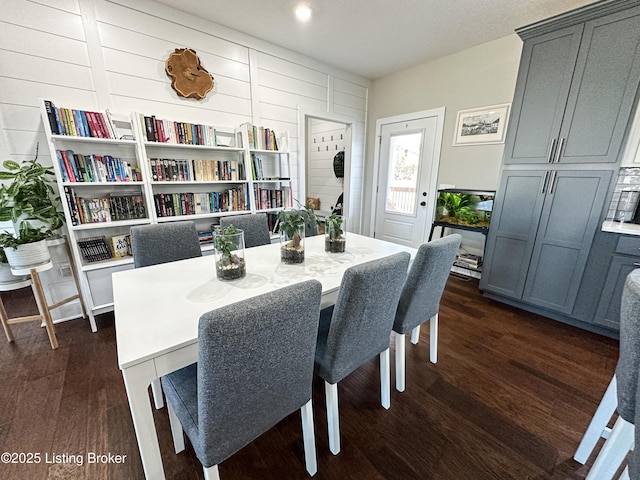 dining space with dark wood finished floors