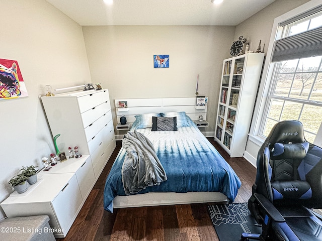 bedroom with multiple windows, recessed lighting, wood finished floors, and baseboards