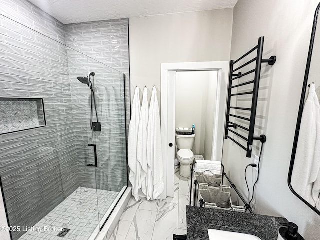 full bath with toilet, marble finish floor, a shower stall, and vanity