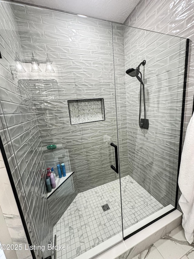 bathroom featuring a shower stall