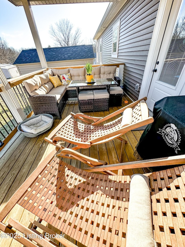 wooden deck featuring an outdoor living space