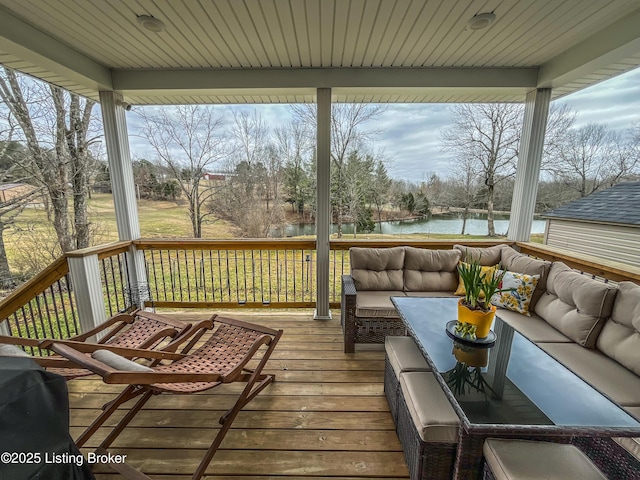 deck featuring a water view and an outdoor hangout area