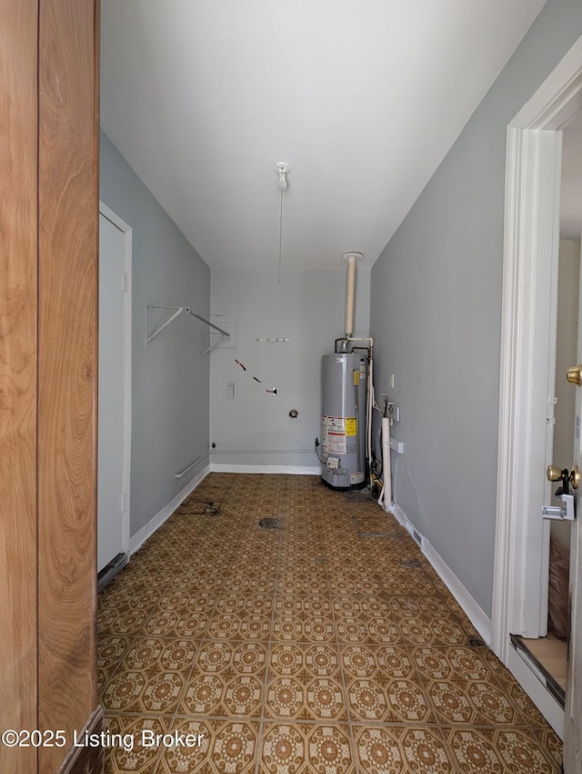 interior space featuring gas water heater and baseboards