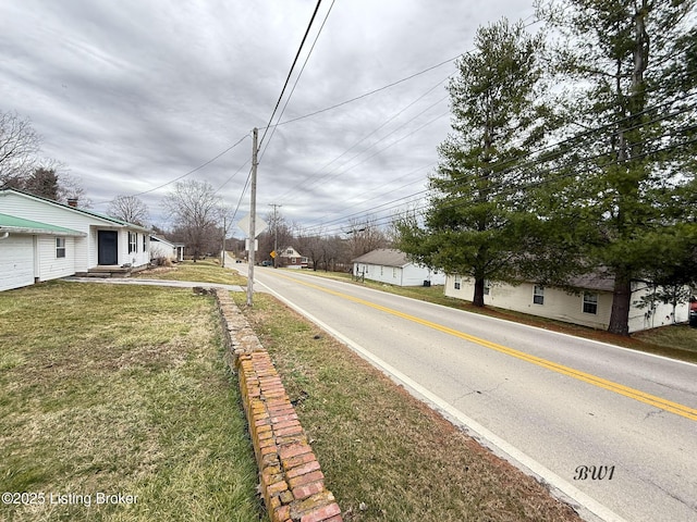 view of street with traffic signs and a residential view