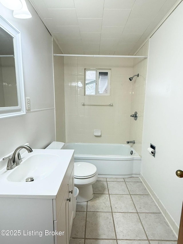 full bath with shower / bathtub combination, toilet, vanity, baseboards, and tile patterned floors